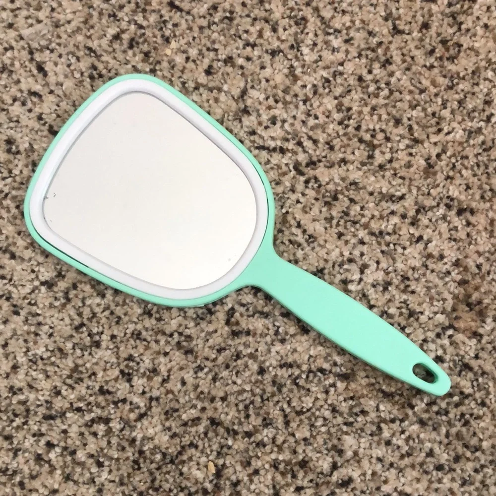 Three hand held mirrors. Good condition. The blue and the green one are vintage